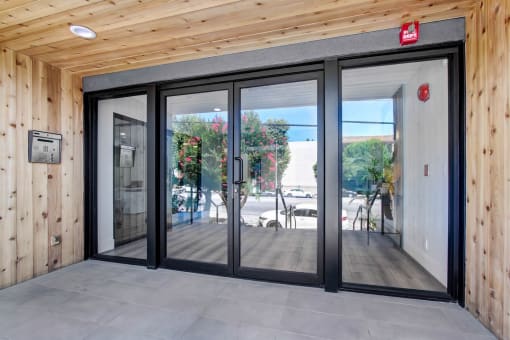 a sliding glass door in a wooden building