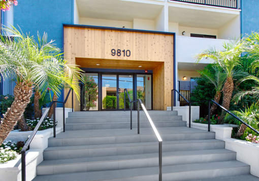 the facade of a building with a staircase in front of it