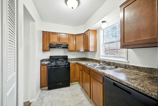 Kitchen in a 3-bedroom townhome at Ashton Pointe Apartments.