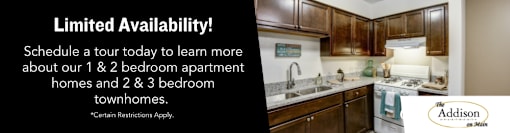 A kitchen interior with a sign that says "Limited Availability! Schedule a tour today to learn more about our 1 & 2 bedroom apartment homes and 2 & 3 bedroom townhomes."