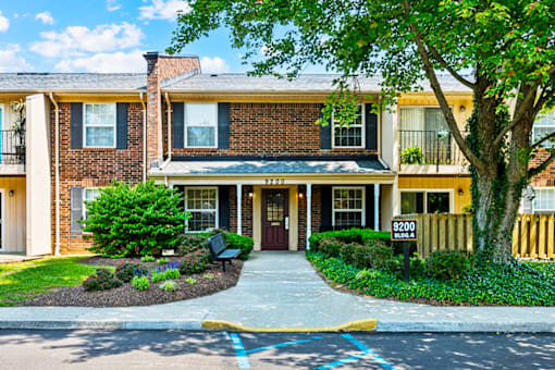 Exterior view of an apartment building at Blairwood Apartments in Louisville, showcasing brick architecture and well-maintained landscaping.