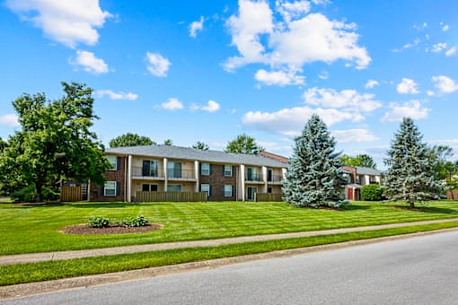 Exterior view of an apartment building at Blairwood Apartments in Louisville, showcasing brick architecture and well-maintained landscaping.