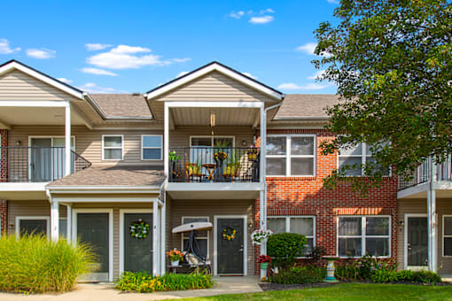 Apartment building exterior with sidewalk at Brownsburg Pointe.