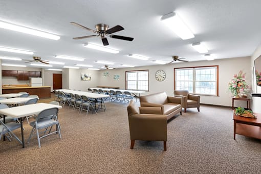 Community room at Fairington of Louisville with comfortable seating.