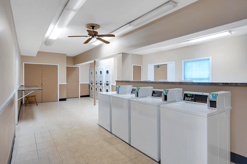 Apartment laundry facility at Mount Vernon with washers, dryers, and a clean, organized space for doing laundry.