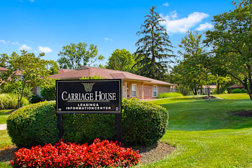 Leasing office sign at Carriage House Glendale Apartments.