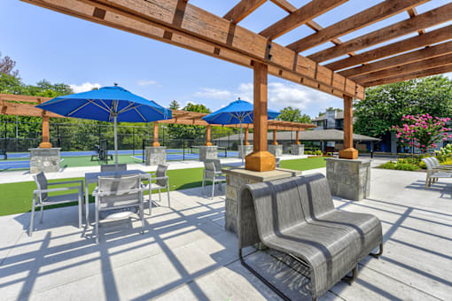 Outdoor pergola with seating at  Woods of Fairfax.