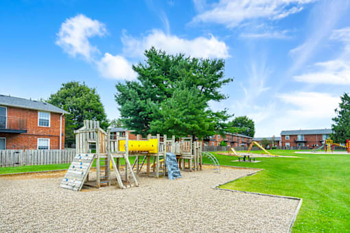 Apartment playground at Mount Vernon, featuring play equipment.