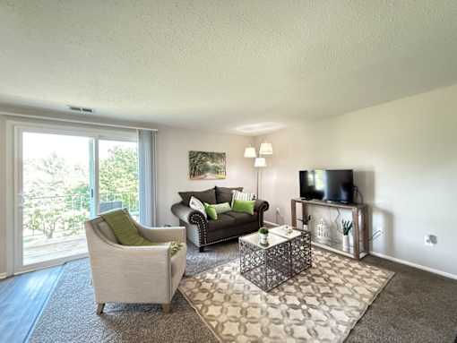 Living Room with Sliding Glass Door to Patio or Balcony at Ashmore Trace