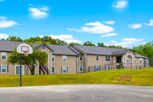 Basketball hoop and apartment building exterior at The Reserve at Chandlers Glen.