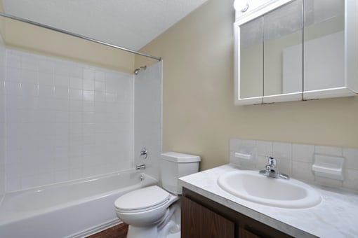 Bathroom with a tub, vanity and a mirror, in a 1-bed, 1-bath apartment at Mount Vernon.