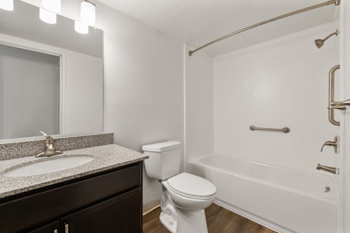 Bathroom in a 1-bedroom, 1-bathroom apartment at Country View Apartments, featuring modern fixtures, and a  tub.