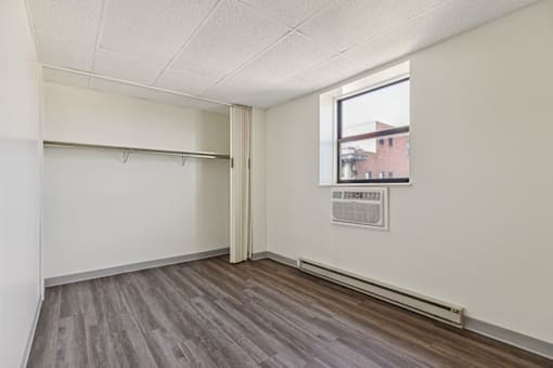 Bedroom and closet in a one-bedroom apartment at Fowler in Lafayette, IN.