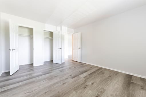 Bedroom with built-in closets and ample storage space at Northwood on the Trail.