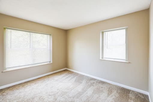 Bedroom in a 2-bedroom apartment at Hampton Place Apartments, featuring a spacious layout and natural light.