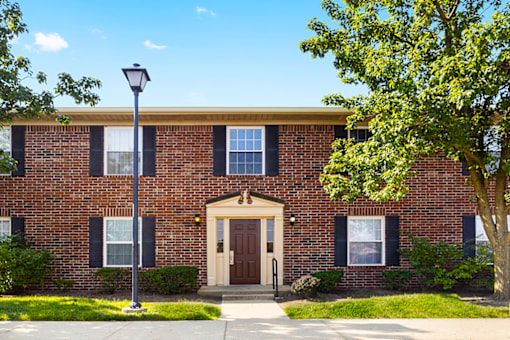 Exterior view of a building at Richfield Apartments West Lafayette, showcasing well-maintained landscaping.