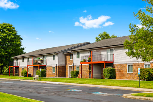 Exterior view of building with balconies and patios at Blueridge Terrace Apartments.