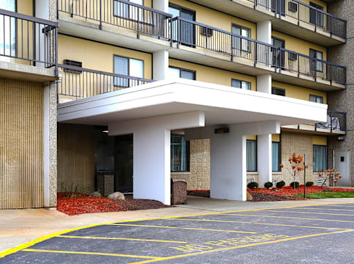 Exterior view of the entrance to Kentwood Square Apartments.