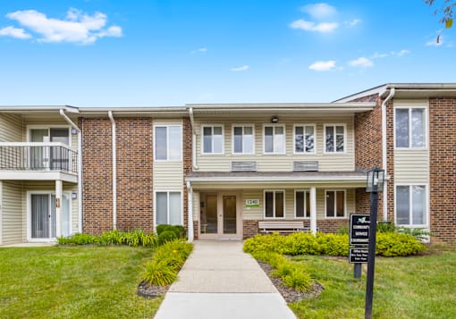 Exterior view of Greenbriar Apartments, highlighting landscaped grounds, and welcoming entrance.