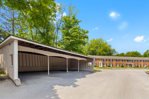 Carport at Hampton Court Apartments, featuring covered parking spaces.