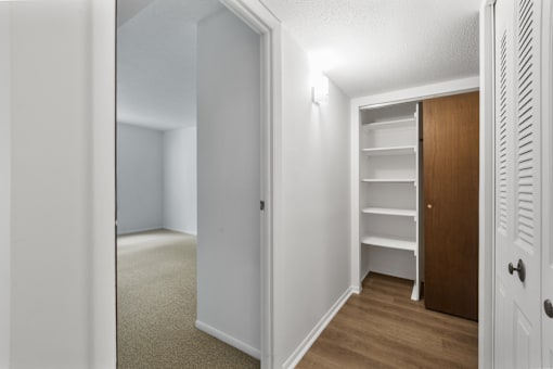 Closet in a 1-bed, 1-bath apartment at Carriage House Glendale, offering spacious storage with built-in shelving.