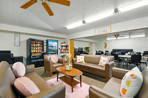 Clubhouse community room at Hammond Elderly Apartments with seating and gathering space for seniors.