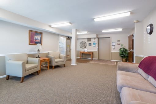 Clubhouse with comfortable seating at Cambridge Square Apartments in Beech Grove, IN