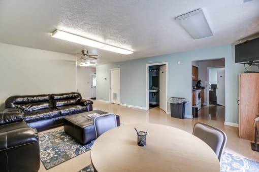 Clubhouse entertainment area with seating  at  Valley Ridge Apartments