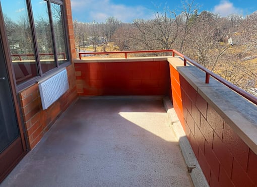 Scenic community balcony at Marshall House Apartments offering views for residents.