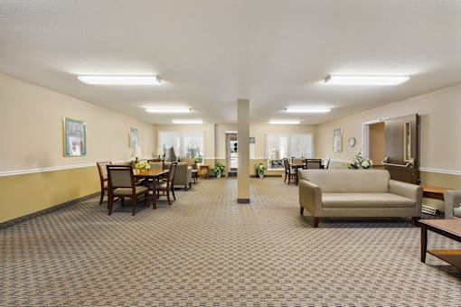 Interior view of the community clubhouse at Fairington Apartments in Lafayette, featuring comfortable seating areas.