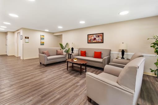 Spacious community room at Greenbriar Apartments, featuring comfortable seating.