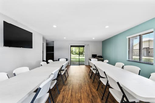 Community room at Lebanon Manor Apartments with tables and chairs.