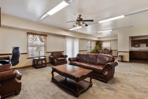 Lounge area in the community room at Richfield Apartments in Fort Wayne, with comfortable seating for resident gatherings.