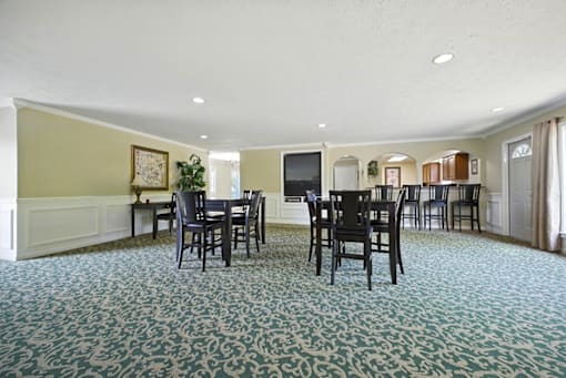 Community room seating area at Ashton Pointe Apartments.