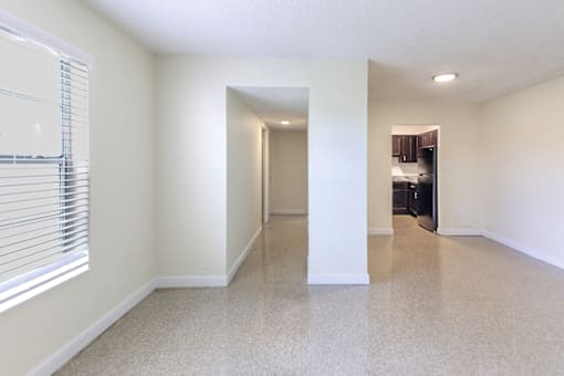 Corridor in a 2-bed, 1-bath apartment at Cambridge Square Apartments in Lauderdale Lakes, providing access to other rooms..