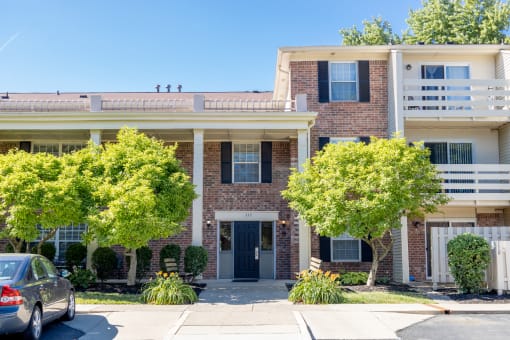 Exterior Apartment Building with parking space in front of the building at Cambridge Square Apartments in Beech Grove, IN