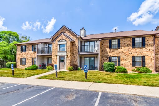 Exterior view of Cedar Ridge Apartments with parking lot