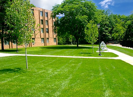 Exterior view of Marshall House Apartments showcasing well-maintained surroundings.