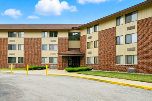 Exterior view of Hammond Elderly Apartments building with landscaped surroundings.