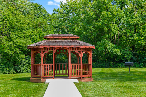 Gazebo and picnic area at Blueridge Terrace Apartments, surrounded by green space and landscaping.