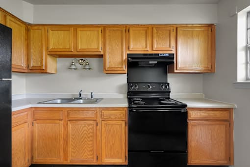 Kitchen in a 3-bed, 1-bath townhome at Valley Ridge Apartments with kitchen appliances and ample cabinetry.