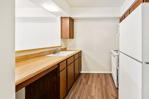 Kitchen in a one-bedroom, one-bath apartment at Cambridge Square Apartments in Bedford, Indiana.