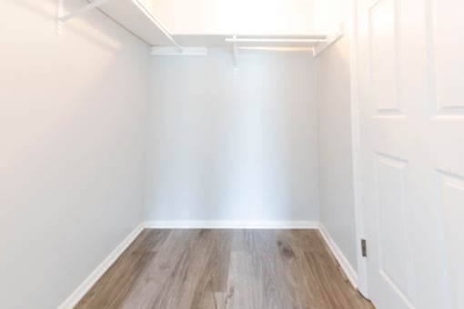 Spacious walk-in closet with plenty of shelving and hanging space at Northwood on the Trail.