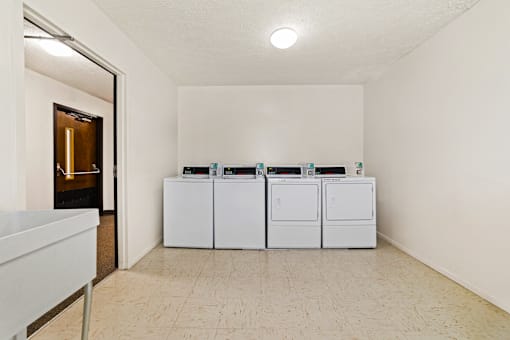 Laundry facility at Fairington Apartments in Anderson, featuring washers and dryers.
