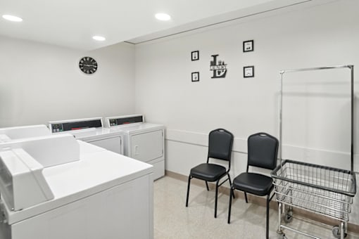 Laundry room with washers and dryers in Hammond Elderly Apartments.