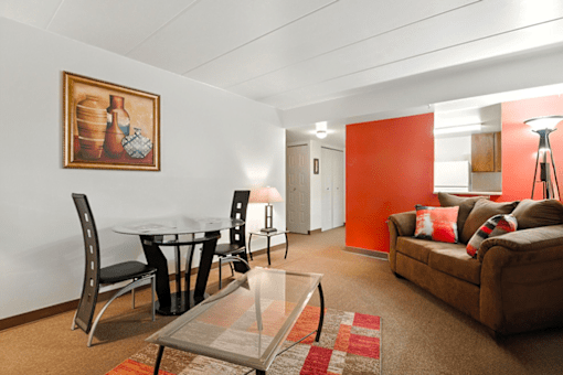 Living and dining area in a one-bedroom apartment at Hammond Elderly Apartments.