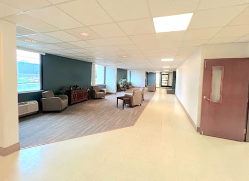 Lobby lounge with seating at Kentwood Square Apartments.