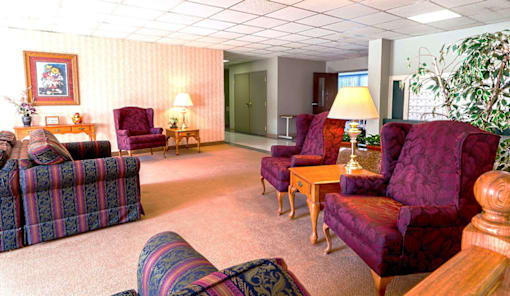 Lobby lounge area at Village Square Apartments with comfortable seating.