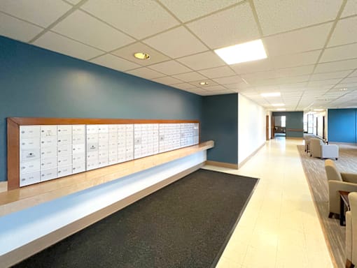 Mail room with lockers at Kentwood Square Apartments.
