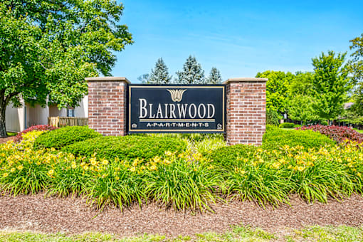 Monument sign for Blairwood Apartments in Louisville, positioned near the entrance with landscaped surroundings.